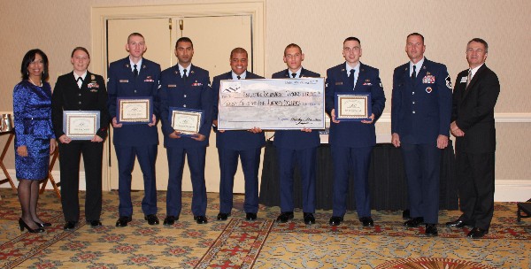 Chapter members and enlisted scholarship winners in May are (l-r) Col. Jenkins-Harden; 
Petty Officer 1st Class Amy Cantrell, USN; Senior Airman Joshua Green, USAF; Airman 1st Class Manoj Khatiwada, USAF; Airman 1st Class Dante Cousan, USAF; Airman 1st Class Stephan Connors, USAF; Senior Airman James Paterick, USAF (Lewis Award); Master Sgt. Kent Keiser, USAF, Enlisted Affairs; and Col. Pohlmann.